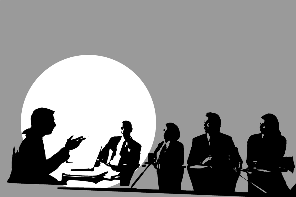Meeting mit fünf Personen an einem Tisch